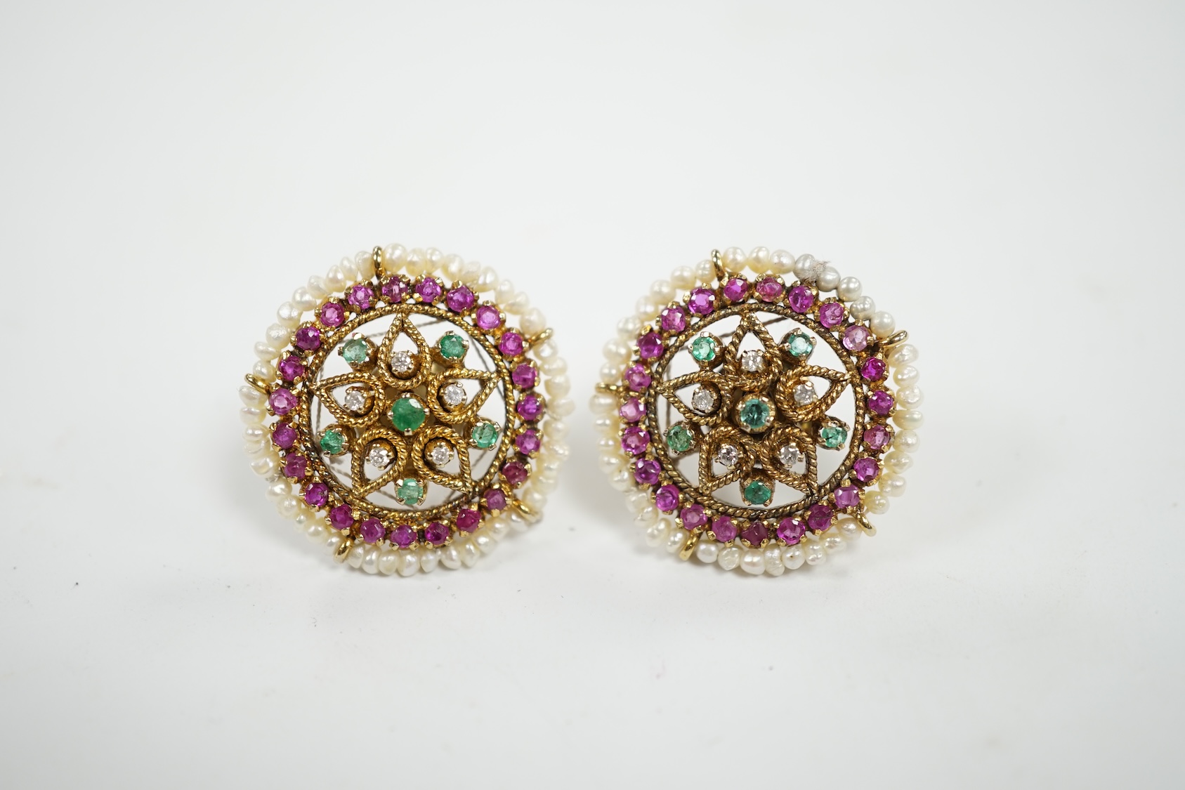 A pair of 20th century Indian yellow metal and multi gem set disc shaped earrings, 22mm. Condition - fair